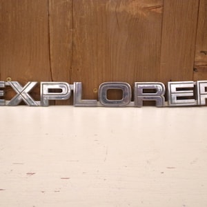 Explorer Emblem Large SUV Accessory Silver Plastic Vintage Used Brand OEM Factory Authentic Real Original Model Number Ford Name