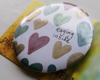 Raging inside brooch. Small Anti-valentine gift. Cute political statement. Hand illustrated and metallic heart painted large pin badge