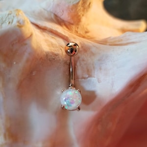 14G Rose gold belly ring with simulated white glitter opal prong set