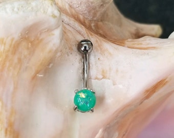 14G Surgical Steel belly ring with simulated light green glitter opal prong set