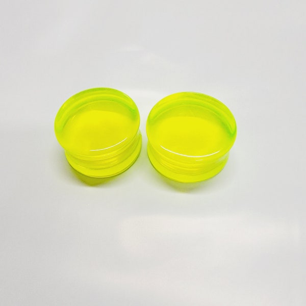 Transparent fluorescent green acrylic plugs - double flare saddle style gauges