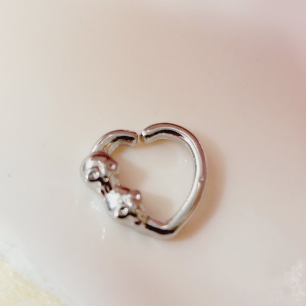 16G heart shaped seamless ring with 2 tiny skulls.  VERY SMALL RIGHT ear daith or tragus jewelry