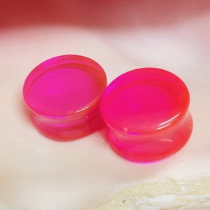Pink acrylic plugs double flare semi transparent gauges