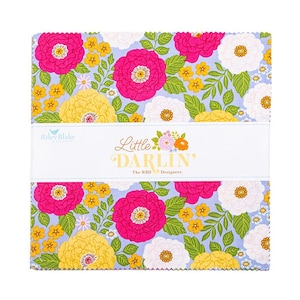 May include: A stack of fabric squares with a floral pattern. The design features large pink and white flowers, yellow accents, and green leaves on a light blue background. The text "Little Darlin'" is visible.