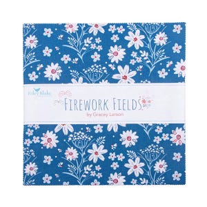 May include: A stack of fabric squares with a blue floral pattern. The fabric features white flowers with red centers and green stems. A white band across the middle reads "Firework Fields" by Gracey Larson.