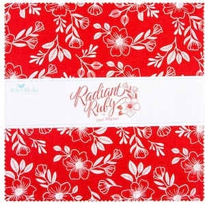 May include: A stack of red fabric squares with a white floral pattern. The fabric is labeled "Radiant Ruby" by Riley Blake Designs. The design features stylized flowers and leaves.