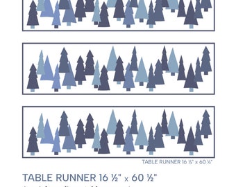 May include: A table runner pattern featuring a winter forest scene with blue and gray trees. The pattern is for a table runner measuring 16 1/2 inches by 60 1/2 inches. The text "Magical Winter Forest" and "Table Runner 16 1/2" x 60 1/2" is included in the image.