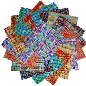 May include: A collection of colorful, square fabric swatches arranged in a circular pattern. The swatches feature a plaid design in various colors, including red, blue, green, and yellow. The fabric appears to be woven, with visible intersecting lines.
