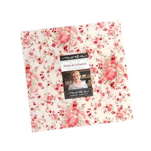May include: A square fabric bundle with a floral pattern in shades of pink and red on a cream background. The fabric is labeled "Petals & Polkadots" by Bunny Hill Designs, with the Moda Fabrics & Supplies logo.