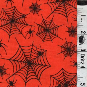 May include: Red fabric with a repeating pattern of black spiderwebs and spiders. The spiderwebs are detailed with radial lines, and the spiders have eight legs. The fabric is suitable for Halloween-themed crafts and decorations.
