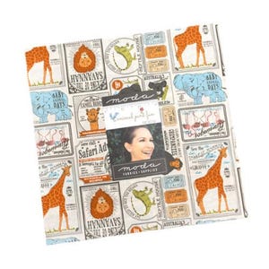 May include: A square fabric panel featuring a safari animal print with giraffes, lions, elephants, and flamingos. The fabric has a vintage travel poster design with the text "Safari Ad" and "See the Tallest Mammal Giraffe". A Moda Fabrics label is attached.