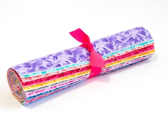 May include: A roll of colorful fabric with a pink ribbon tied around it. The fabric has a white background with a brushstroke pattern in various colors.