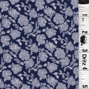 May include: Navy blue fabric with a repeating floral pattern. The design features white flowers and leaves, creating a classic and elegant look. The fabric is suitable for various sewing and crafting projects.