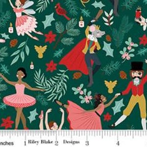 May include: A dark green fabric featuring a repeating pattern of ballet dancers, a mouse king in a red cape, and a man in a top hat. The design includes festive elements like pine branches, holly, poinsettias, and candles. A ruler is visible at the bottom.