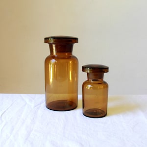 Vintage Apothecary jars - 2 x amber glass lidded jars - original specimen medicine jars - liquid measurements - pharmaceutical storage