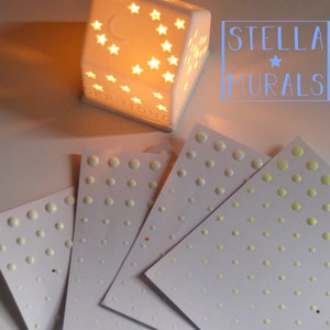 Realistic glow in the dark star stickers for an all night glowing star ceiling. Colours are green, aqua and blue. Removable stickers for ceilings or walls.