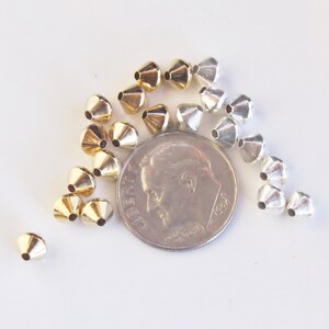 Nickel free silver or gold tone bicone beads for jewelry.