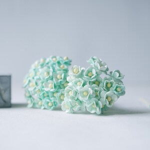 Paper Flower, 100 pcs., Butterfly flowers, mint color 1cm., yellow pollen.