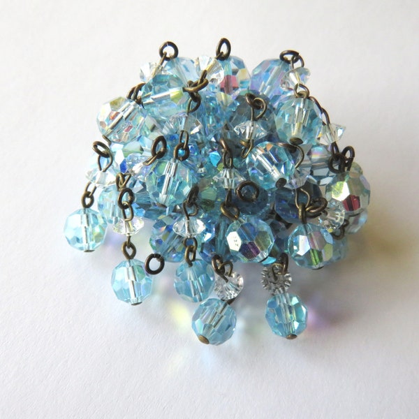 Broche cascade avec 17 pendeloques à perles cristal facetté avec finition Aurore Boréale bleue