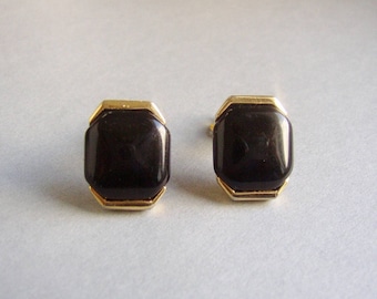 TRIFARI Crown – Hexagonal gold tone clip on earrings embellished with black plastic inlay