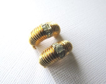 NINA RICCI - Gilded half hoop clip on earrings ridged finish embellished with clear rhinestones faux grain setting