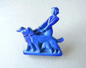 Art Deco blue molded plastic brooch lady holding 2 greyhounds with hand painted details