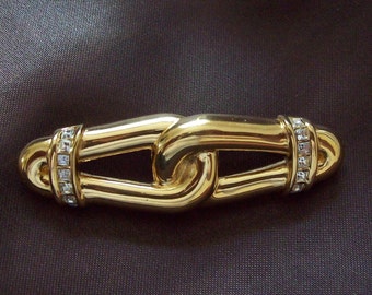 CHRISTIAN DIOR - Elongated brooch gilded metal set with two rows Swarovski crystals