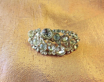 Curved shield brooch pin pot metal encrusted with clear facetted rhinestones 1930s