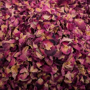 May include: A close-up of dried rose petals, a mix of pink and beige hues, perfect for crafting or adding a touch of natural beauty to your home.