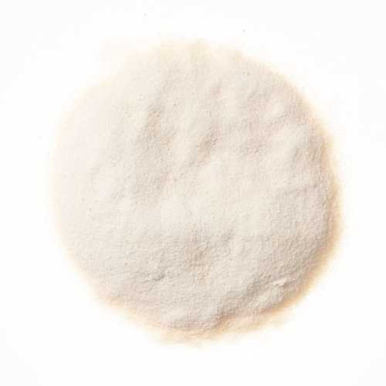 May include: A close-up of a pile of white powder, likely a food ingredient like cornstarch or tapioca starch.