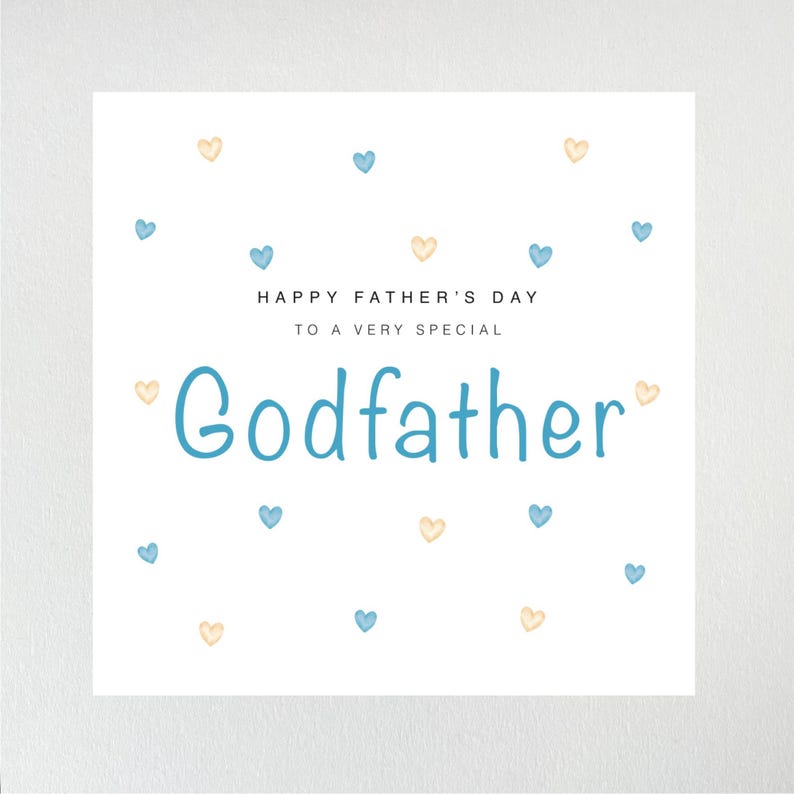 May include: A white card with blue and yellow hearts scattered across the surface. The card reads "Happy Father's Day to a very special Godfather".