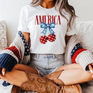 Camiseta con estampado de cereza americana, camiseta del 4 de julio, camiseta con lazo patriótico, camiseta de verano de EE. UU., camiseta de inspiración vintage del 4 de julio, cereza patriótica