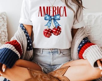 Camiseta America Cherry para o 4 de Julho, Camiseta com Estampa Patriótica e Laço, Camiseta de Verão Americana, Camiseta Vintage Inspirada no 4 de Julho, Camiseta Patriótica Cherry