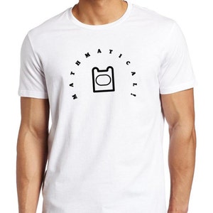 May include: White t-shirt with a black graphic design and the word "MATHEMATICAL!" in a semi-circular arrangement above the graphic. The graphic is a black outline of a shape with a rounded top and a rectangular body.