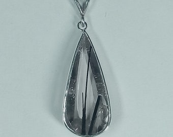 Tourmalinated quartz pendant