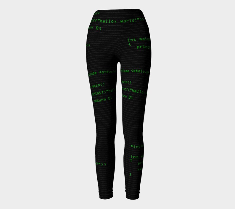May include: Black leggings with a green code print. The code includes the text "hello world!" and "int main".