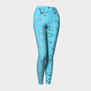 May include: Light blue yoga leggings with a white and grey pattern of connected circles and lines with letters inside the circles.
