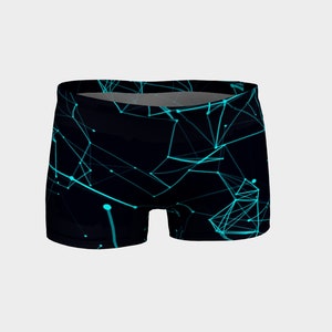 May include: Black athletic shorts with a geometric pattern of teal blue lines and dots on a black background.