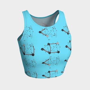 May include: A blue crop top with a repeating pattern of black and brown diagrams with numbers and arrows. The diagrams are similar to flow charts.