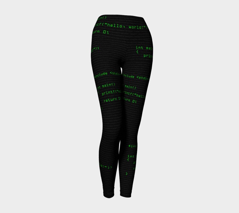 May include: Black leggings with a green code print. The code includes the text "hello world!" and "return 0;"