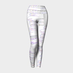 May include: White leggings with a pattern of computer code printed all over. The code is in various colours, including blue, purple, and orange.