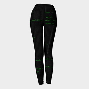 May include: Black leggings with a green code print. The code includes the text "hello world!" and "stdio.h".