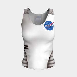 May include: White tank top featuring the NASA logo on the front. The sleeveless top has a scoop neck and a design that mimics a spacesuit. The top has gray and black accents.