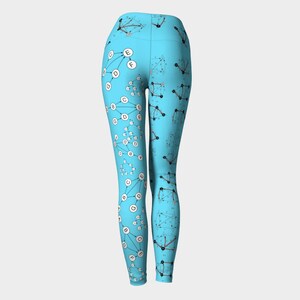 May include: Blue leggings with a white and black pattern of connected circles and letters. The pattern resembles a graph or network.