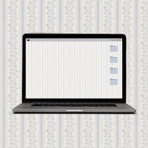 May include: A laptop computer with a white background and a few folders open on the desktop. The date and time are displayed in the top right corner of the screen.