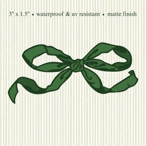 May include: A dark green bow illustration with a matte finish, set against a striped background. The bow measures 7.6 cm by 3.8 cm and is waterproof and UV resistant.