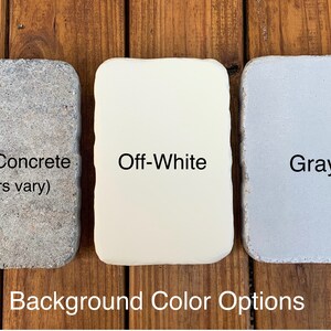 May include: Three rectangular tiles with rounded corners displayed as background color options. The left tile is textured bare concrete, the center tile is off-white, and the right tile is gray. Text labels identify each color option.