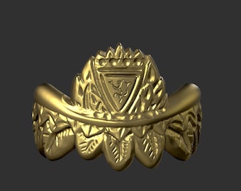 May include: A gold ring with a detailed design featuring a crest with a stylized animal and a crown of leaves.