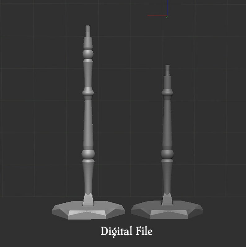May include: A 3D digital file rendering of two gray, vertical, spindle-shaped stands with octagonal bases. Each stand features a central column with decorative rounded segments and a flat top. The text "Digital File" is centered below the objects.
