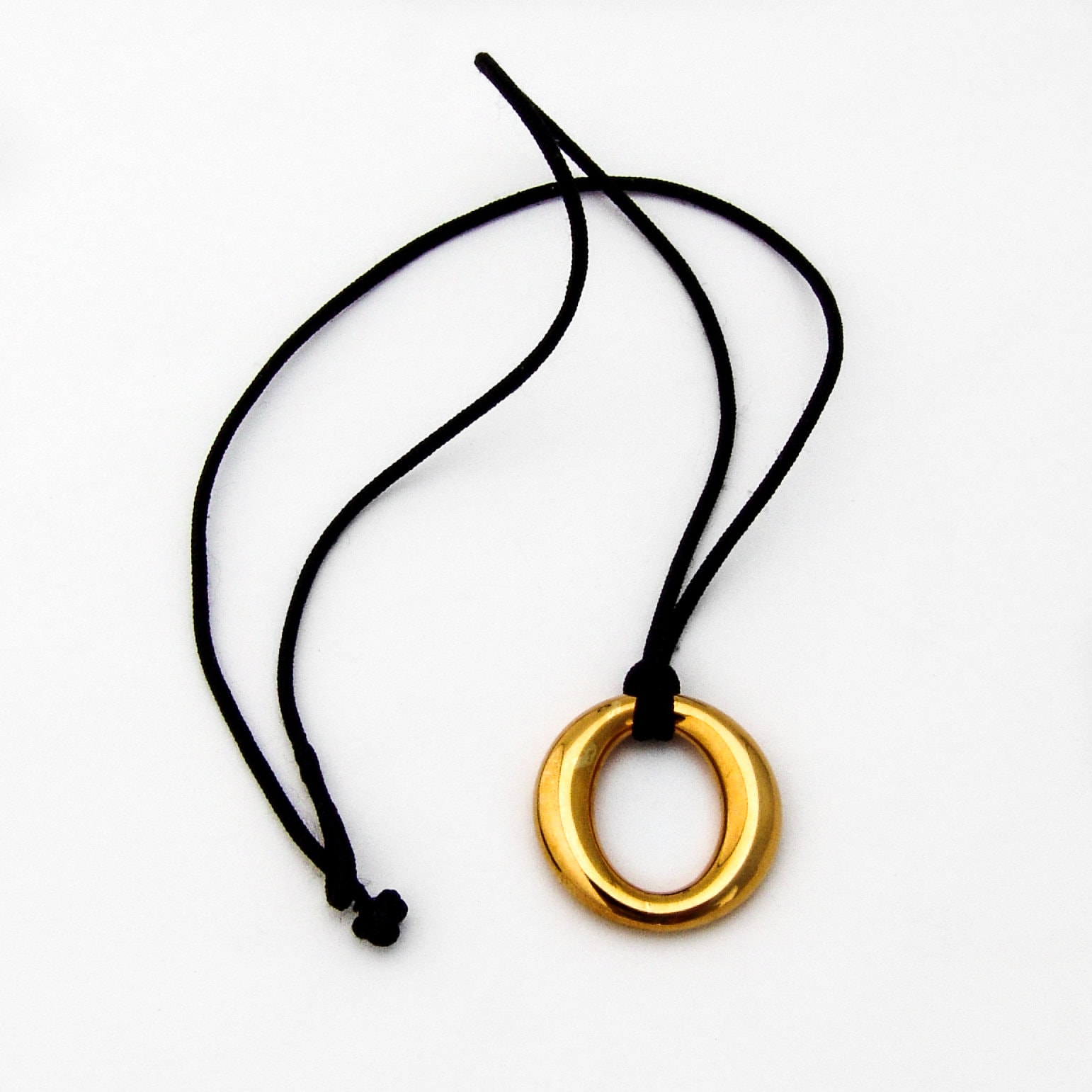 Elsa Peretti® Sevillana™ pendant in 18k gold with a silk cord, small.